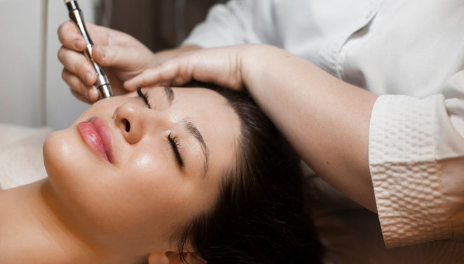 LED light therapy after microneedling - woman receiving microneedling treatment