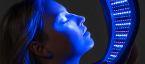 Woman using Celluma Blue Light Therapy panel on her face, illustrating safe and effective low-level blue light treatment for pigmentation, acne, and skin clarity.