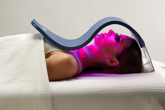 A woman uses the Celluma SKIN, a LED light therapy device for skin-related concerns such as wrinkles and acne