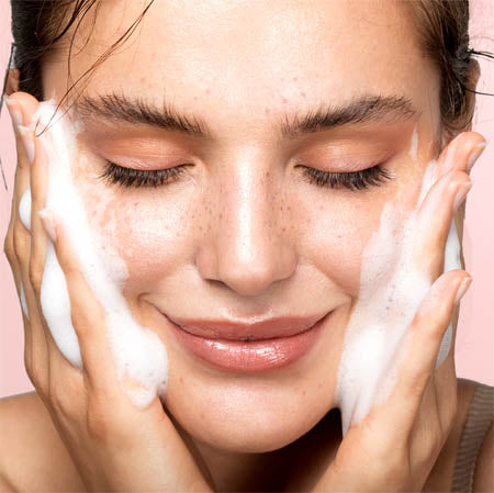Woman using a skin care product