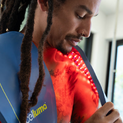 Men using Celluma on shoulders for pain treatment