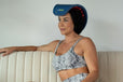 Woman using Celluma product on hair for hair restoration