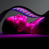 Celluma PRO PLUS LED red light therapy device used on a woman's face for anti-aging treatment