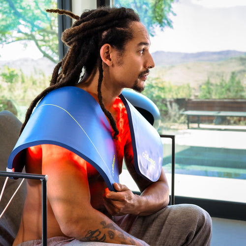 Male using the Celluma PRO on aches and pain mode using red and near-infrared light therapy.
